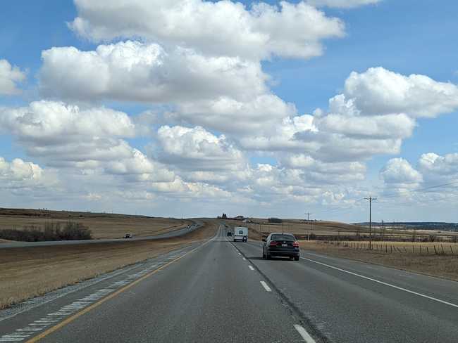 A divided freeway through the prairie.