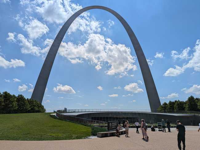 Gateway Arch by itself. There's a plaza out front, and parkland in the back. You can see the entrance to the museum hidden underneath the park.