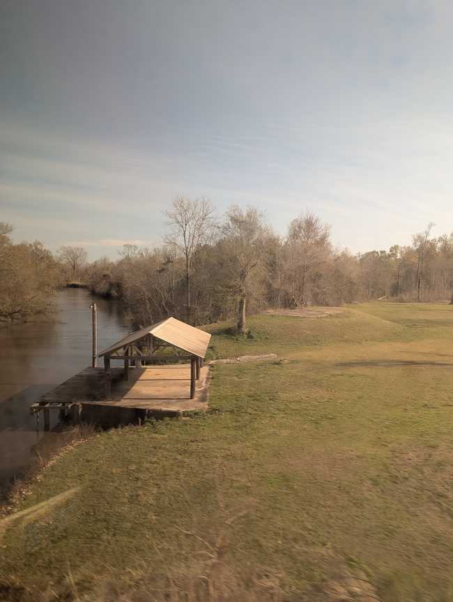 A little dock along a river.