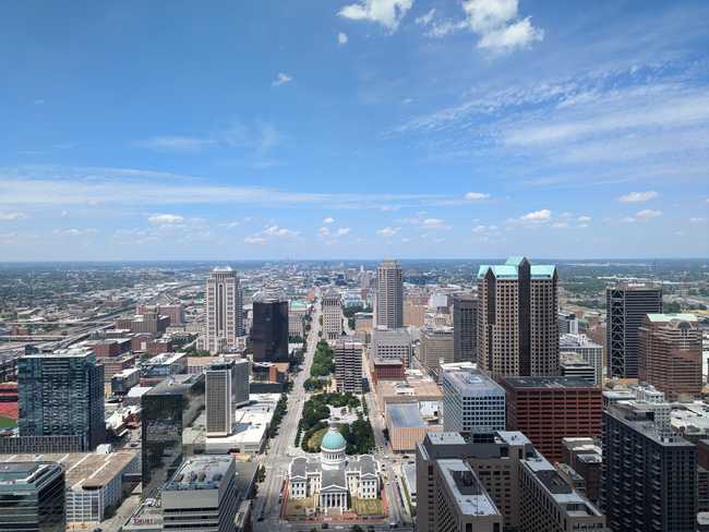 A city skyline from up high. The horizon is perfectly flat.