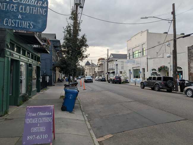 Streetscape. The buildings are two stories and contain local shops.