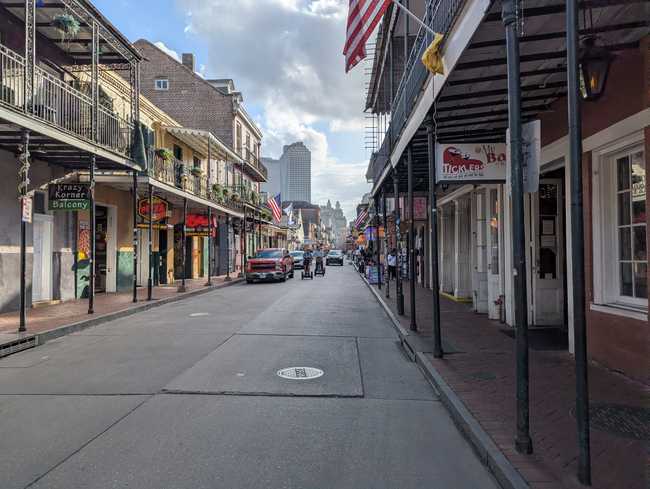 More buildings, with two folk incoming on segways.